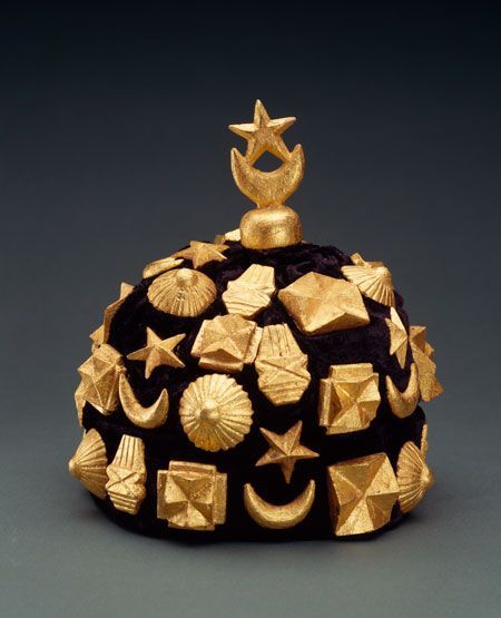 Gold ceremonial headpiece with star and shell motifs